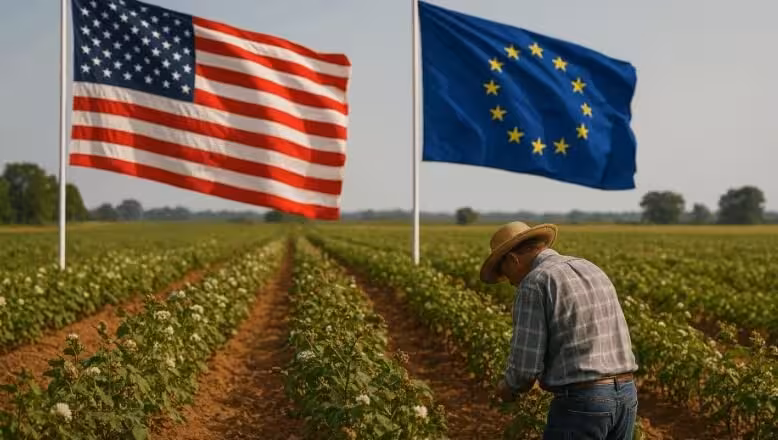 Imagen de un agricultor con banderas de EE.UU y la UE en un cultivo (Foto Asaja.com)